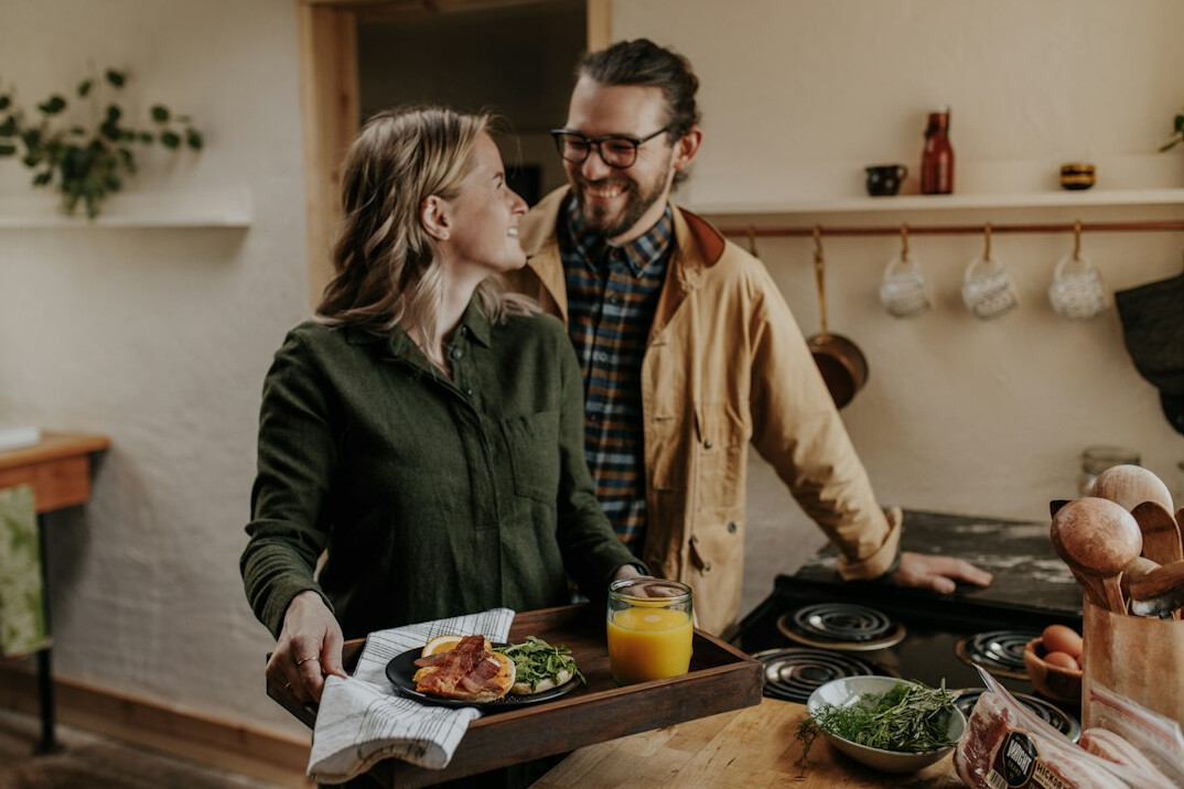 Mature couple discussing household expenses together at a table