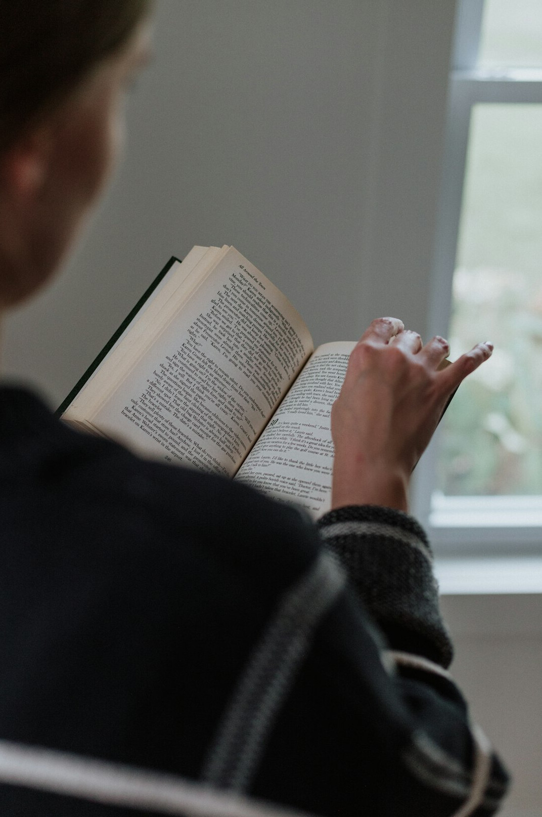 person reading financial book