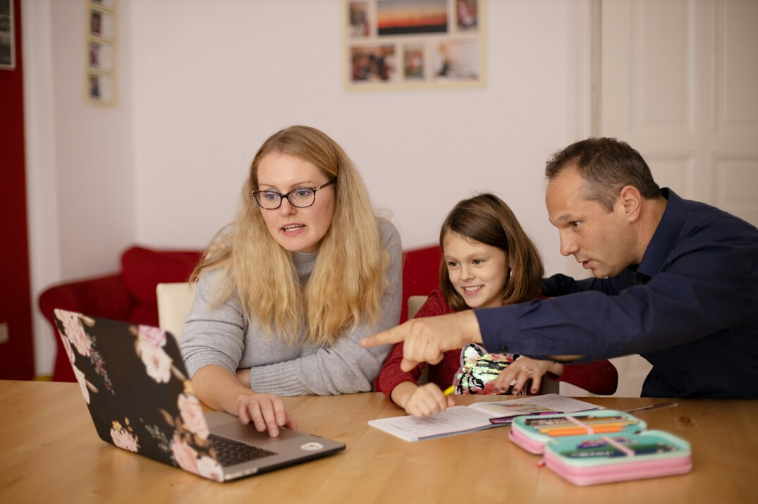 family discussing finances at table
