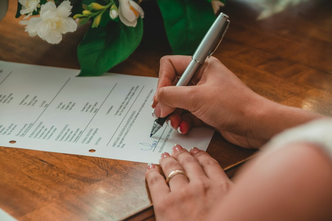 person writing household budget plan